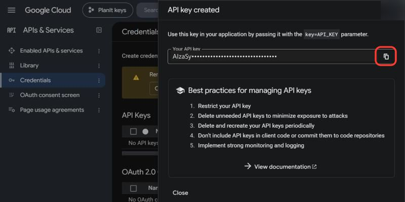 API key created dialog with the copy button marked; the key is hidden